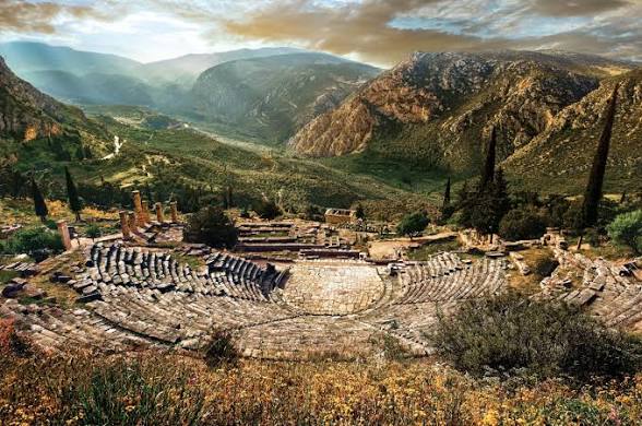The ancient theatre of Delphi with the Pleistos valley below — a highlight of the Delphi day tour