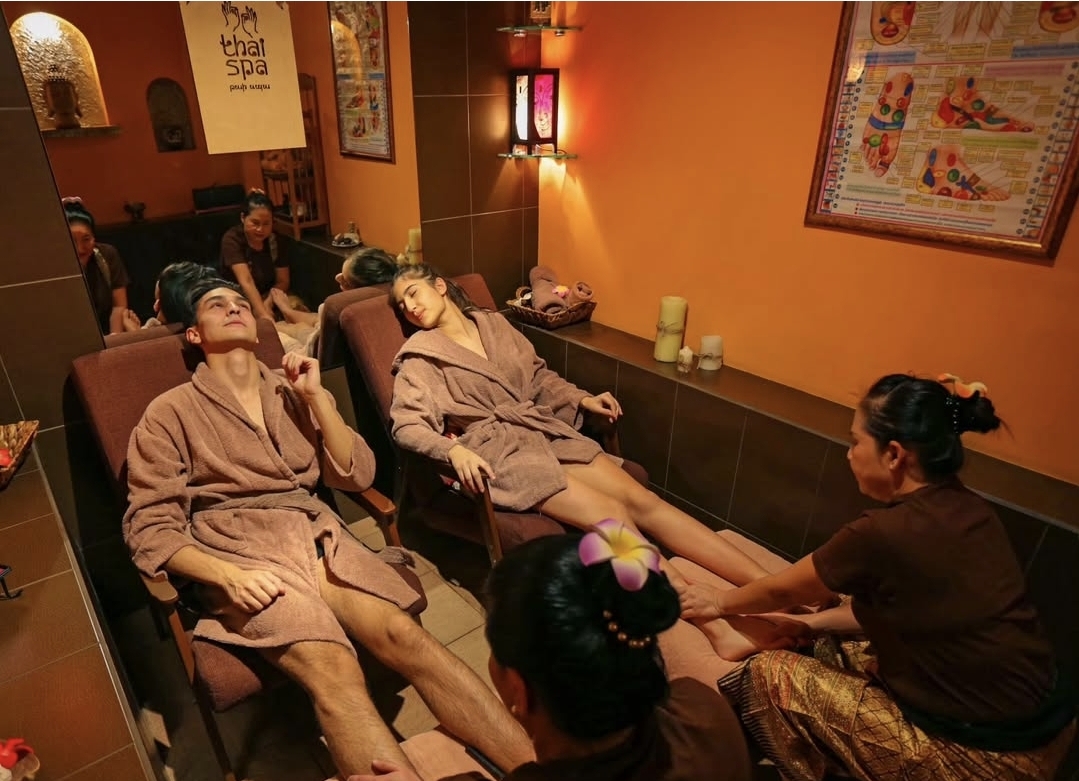 Guests enjoying foot massage in the private cubicles at Nuad Thai Massage Athens