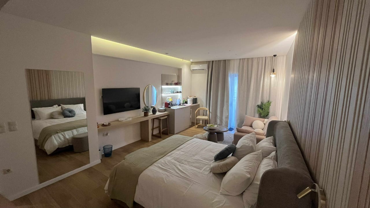 Cosy couples suite with two beds and soft lighting