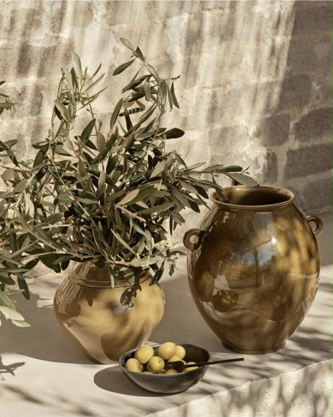The Greek Experience at Nuad Thai Massage Athens — a golden, sunlit massage ritual with olive branches and Mediterranean accents